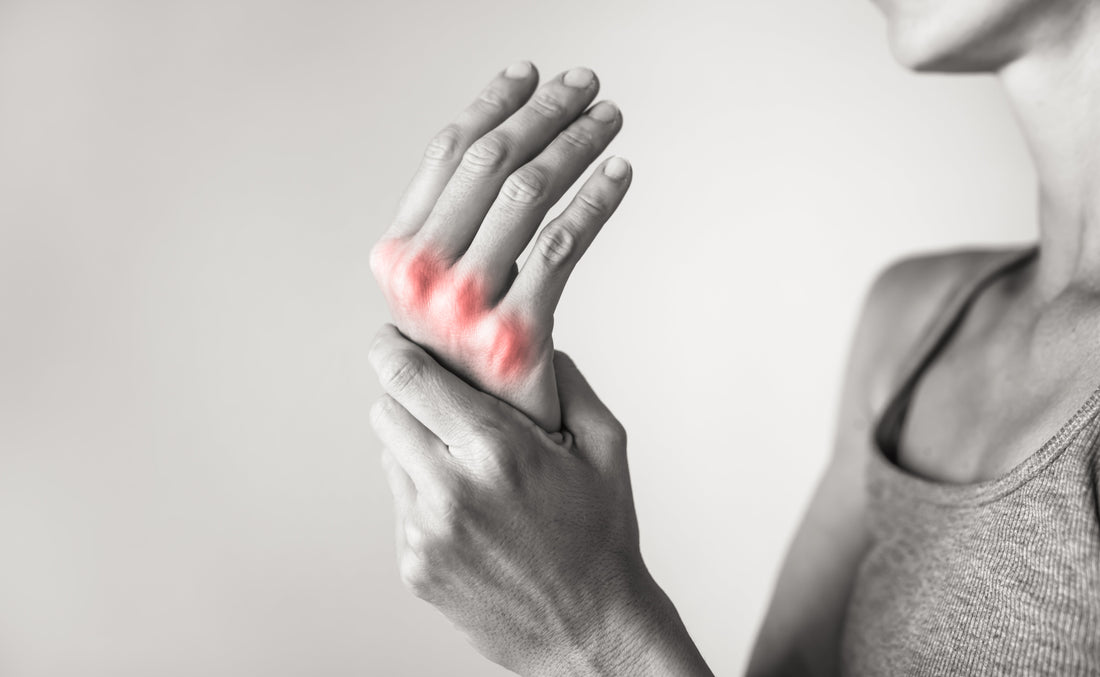 A symptoms of hand joint pain and inflammation, commonly associated with conditions treated by rheumatologists. 